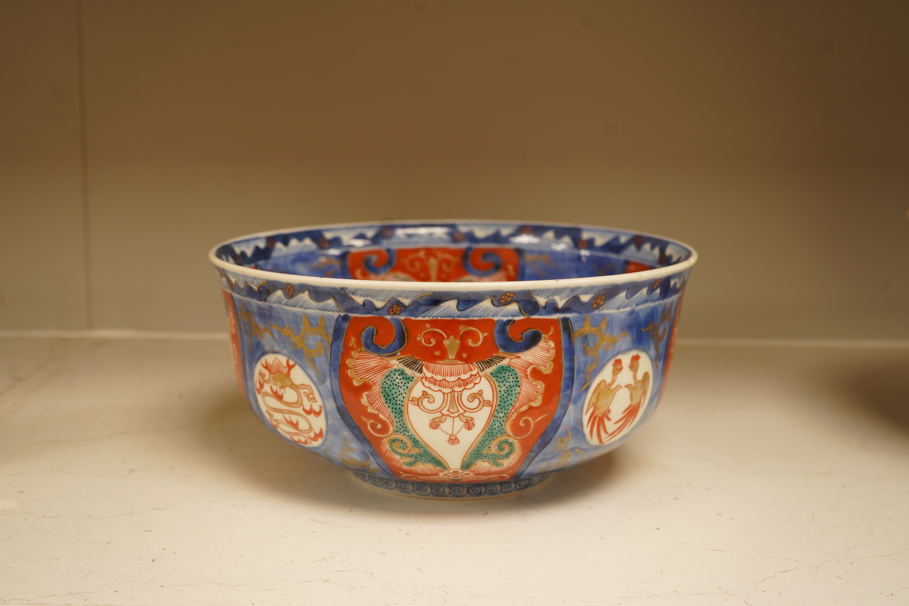 A Japanese Imari bowl and a similar fluted dish, bowl 25cm diameter
